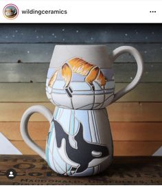 a ceramic mug with an image of a cat on it