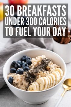 a bowl filled with oatmeal, bananas and blueberries on top of a table