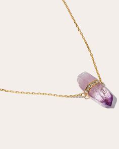 Inspired by earth's natural minerals, this 14-karat gold necklace features a unique, hand-selected Vera Cruz amethyst stone that is believed to amplify the wearer’s creative elements. Dainty bezel-set diamonds wrap around the gradient-hued gem for a touch of glam. 14k yellow gold, diamond and Vera Cruz amethyst Diamond: 0.13 ctw Professional cleaning recommend Handmade in NYC, USA Size & Fit Length: 16-18in | JIA JIA Women's Crystalline Vera Cruz Amethyst Diamond Bar Necklace in Gold Fine Jewelry Amethyst Necklace In Yellow Gold, Fine Jewelry Yellow Gold Amethyst Necklaces, Luxury Yellow Gold Amethyst Necklace, Luxury Amethyst Pendant Jewelry, Luxury Faceted Amethyst Necklaces, Creative Elements, Diamond Bar Necklace, Vera Cruz, Diamond Bar