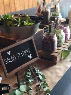 a salad station is set up on a table