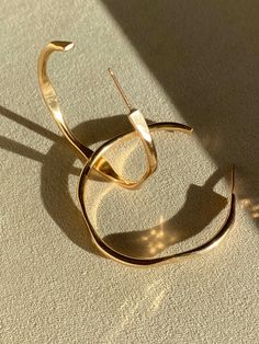 Lume Hoops Modern 14k Gold Filled Hoop Earrings, Hand Forged 14k Gold Hoop Jewelry, Chic 14k Gold Hoop Earrings Gift, Single Metal Earring With A Modern Twist, Single Earring In Metal With A Modern Twist, Modern Gold Plated Hoop Jewelry, Modern Hand Forged Hoop Earrings For Gift, Single Earring With A Modern Twist, Modern Hand Forged Hoop Earrings Gift