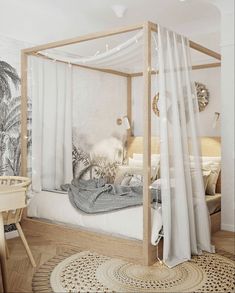 a canopy bed with white curtains in a bedroom next to a table and chair on the floor