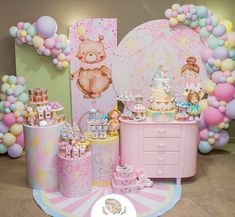 a pink and gold baby shower party with teddy bears, balloons, cake and decorations