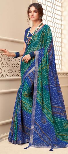 Cost Includes Saree,Unstitched BlouseFall & Edging Work Description: Blue, Green color Saree in Chiffon fabric with Bandhej, Border, Printed work Fabric: Chiffon Work: Bandhej, Border, Printed Color Family: Blue, Green Style: Classic, Rajasthani Occasion: Party Wear Saree Dimension: 530 Cm x 110 Cm ( L x W) Blouse Length: 80 Cm Approx Washing Instruction: Dry Wash Transitional Blue Georgette Blouse Piece, Blue Saree With Printed Border, Blue Semi-stitched Saree With Printed Border, Blue Unstitched Saree With Printed Border, Semi-stitched Blue Saree With Printed Border, Unstitched Blue Traditional Wear With Printed Border, Blue Saree With Printed Border For Festivals, Blue Bandhani Print Blouse For Diwali, Blue Semi-stitched Georgette Saree