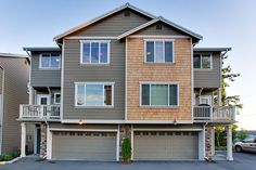 two story apartment building with garages on the second floor