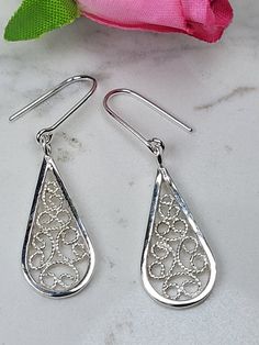 Filigree earrings made by intricate metal work, creating a dainty look. The Boho 925 earrings are inspired by Boho jewelry combined with modern design. These sterling silver long earrings are perfect for a beloved woman, and as a pampering gift for yourself. The earrings are very flattering, comfortable to wear as a jewel for everyday use and impressive as a jewel for a special occasion. The structure of the earrings is  approximately 25 mm long, creating an elegant and unique style. The earrings are made of 925 sterling silver by hand tools only. Each piece of jewelry is handmade to order, therefor due to the special nature of handcrafting, there may be slight differences compared to the jewelry in the photos shown. This adds to the charm and individuality of each piece, making it truly o Filigree Jewelry Design, Silver Filigree Jewelry, Ornate Sterling Silver Teardrop Earrings For Gift, Ornate Sterling Silver Teardrop Earrings As Gift, Sterling Silver Teardrop Earrings With Intricate Design, Sterling Silver Intricate Teardrop Earrings, Silver Filigree Teardrop Earrings For Gift, Sterling Silver Filigree Teardrop Earrings, Elegant Sterling Silver Filigree Teardrop Earrings