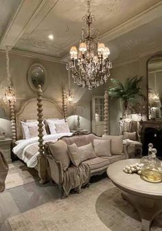 a living room filled with lots of furniture and a chandelier hanging from the ceiling