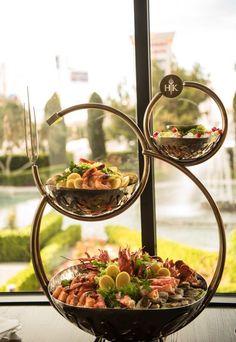 two tiered trays filled with different types of food