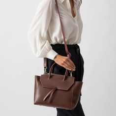 This stylish and effortless medium size bag is handcrafted in Italy with premium quality leather, making it lightweight yet durable. It's easy to clean and maintain, so it'll stay looking as good as new for years to come. With its timeless design and classic look, this tote bag will be a timeless addition to your wardrobe. Whether you're heading out for the day, or going away for the weekend, this midi purse is sure to turn heads wherever you go. Everyday Leather Box Bag With Top Carry Handle, Classic Everyday Box Bag With Detachable Strap, Everyday Classic Box Bag With Detachable Strap, Modern Shoulder Bag With Double Handle And Smooth Grain, Everyday Leather Top Handle Satchel, Everyday Leather Satchel With Top Handle, Timeless Soft Leather Satchel With Top Handle, Leather Top Handle Satchel For Everyday, Classic Box Bag With Detachable Strap For Everyday