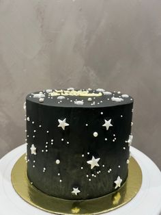 a black and white cake with stars on it