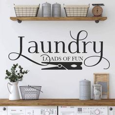 laundry loads of fun wall decal on the wall above washer and dryer