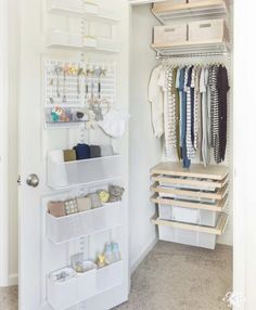 an organized closet with white shelving and hanging items