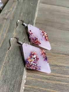 Beautifully bold and colorful pastel pink resin earrings, beautifully designed to be lightweight and dazzling with silver metals. Stylish geometric earrings with resin shapes, perfect statement accessories ♡ Be sure to check out the RED EARRINGS section at EarringsbyLCreations for all beautiful red colored earrings available! https://www.etsy.com/shop/EarringsByLCreations?section_id=28420977 Made with quality materials and always nickel and lead free metals. Naturally colorful jewelry made by ha Pink Pierced Earrings As Gift, Pink Party Earrings With Ear Wire, Pink Resin Earrings For Party, Pink Resin Dangle Jewelry, Pink Resin Drop Earrings, Colored Earrings, Earrings Rose Gold, Earrings Resin, Statement Accessories