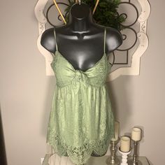 New With Tag By No Boundaries, Sage Green Lace Style, Flashback To The 70s Spaghetti Strap Top Great For Spring Summer. Throw A Leather Jacket Over It In The Winner For Year Around Wear Spring Green Camisole With Straps, Green Lace Cami Top, Green Camisole For Summer, Green Spaghetti Strap Camisole For Beach, Lace Tank Top With Spaghetti Straps For Beach, Lace Spaghetti Strap Tank Top For Beach, Lace Camisole With Spaghetti Straps For The Beach, Green Spaghetti Strap Camisole For Vacation, Green Beach Camisole