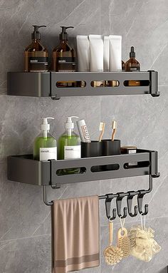 two metal shelfs with soap, lotion and other items on them in a bathroom