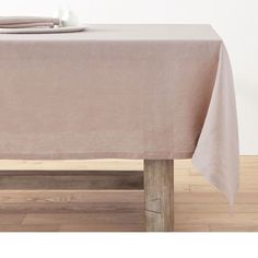 a table with a cloth on it and two napkins sitting on top of it