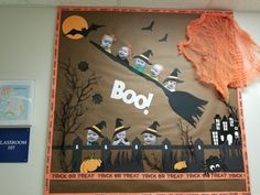 a bulletin board with halloween decorations on it