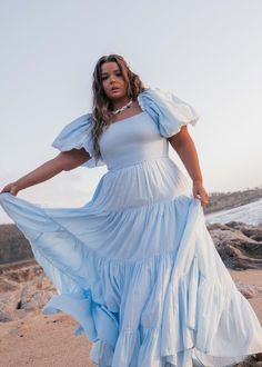 Wandering Free Whether you twirl under the moonlit sky or simply stroll along the shore, you will be an ethereal vision of beauty and confidence in the Luna Dress. Square neckline Elastic puff sleeve Smocked bodice Tiered skirt Pockets Model Details Content + Care 100% Cotton Machine Wash Cold Try On Video Luna Dress Try On Video XS & XL Plus Size Engagement Photos Dress, Engagement Photos Dress, Plus Size Summer Dress, Engagement Photo Dress, Cocktail Dress Style, Dresses Church, Lifestyle Shoot, Inclusive Fashion, Moonlit Sky