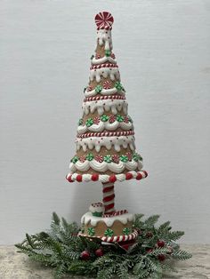 a christmas tree made out of cookies and candy canes