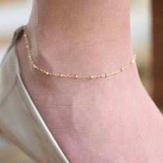 "Solid Gold Simple Anklet - Gold Satellite Chain Anklet This anklet can be worn by itself or with other anklets. ★ The chain and all components are 14K solid yellow gold It comes with a 1/2\" extension chain. (If you order a 9.5\" anklet, it will be a 9.5\" chain plus 1/2\" extension.) Please read our policies before you place your order. https://www.etsy.com/shop/SashJewelry/policy?ref=shopinfo_policies_leftnav To see other Mother daughter necklace set click here: https://www.etsy.com/shop/Sash Delicate Wedding Anklets, Elegant Formal Anklets With Ankle Strap, Elegant Formal Anklets, Elegant Gold Toe Ring Anklets, Elegant Wedding Anklets With Adjustable Chain, Elegant Adjustable Anklets With Delicate Chain, Elegant Adjustable Chain Anklet As Gift, Elegant Adjustable Delicate Chain Anklet, Gold Minimalist Anklet For Wedding