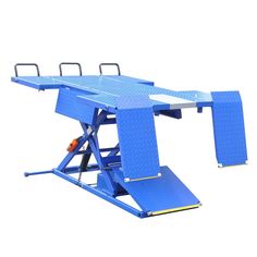 a blue table sitting on top of a metal stand