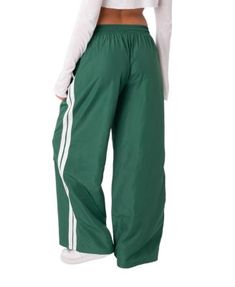 Edikted Fauna Nylon Track Pants Green Nylon Parachute Pants Athleisure, Green Nylon Parachute Pants For Athleisure, Green Nylon Sporty Parachute Pants, Green Nylon Bottoms With Elastic Waistband, Green Parachute Pants With Elastic Waistband For Sports, Green Nylon Long Pants, Green Sporty Parachute Pants, Sporty Green Full-length Parachute Pants, Trendy Sports Pants For Spring