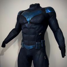 the costume worn by captain america 2 is displayed in front of a white wall,