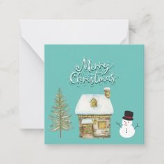 a blue christmas card with a snowman and a house on the front, merry christmas