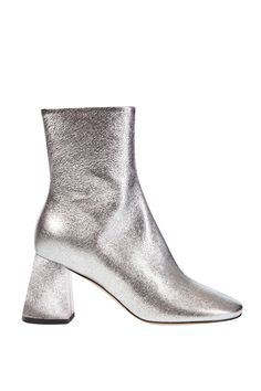 A sleek boot shaped by softened lines, including a rounded toe. Finished in silver crake lamé with flared block heel, internal zipper and buffed outsole. Fits true to size Heel height: 7.5cm (3 inches) 100% Italian leather upper Hand stitched Leather insole, lining, sock and outsole Zip closure Leather block heel Made by hand in Italy PLEASE NOTE ALL SALE ITEMS ARE FINAL SALE Trendy Silver Leather Heeled Boots, Silver Boots Low Heel, Silver Leather Boots With Accents, Silver Fitted Pointed Toe Heeled Boots, Silver Pointed Toe Boots With Buckle Closure, Hemp Fabric, Leather Block Heels, White Sandals, Maxi Dresses Casual