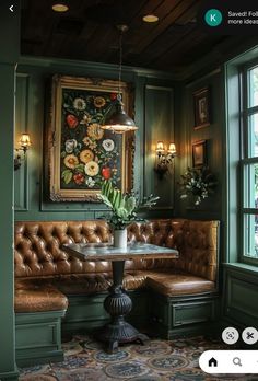 a room with green walls and leather couches