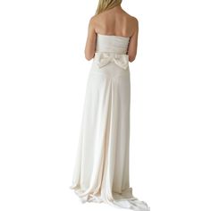 Elegantly adorned with an oversized bow, Valentino's ivory silk strapless gown is a subtle update of the classic column style. Internal zip-fastening boned corset, softly folded pleats at bow-embellished back Draped fishtail Fully lined Internal structure at bodice Cut for a close fit through the body Concealed zip fastening at side Composition: 100% SilkLining: 100% SilkDry clean Made in Italy Bust 32" Waist 30.5" Hip 42.5" Length 67.5" Strapless Wedding Dress With Satin Bow, Elegant Strapless Gown With Bow, Wedding Strapless Dress With Bow And Fitted Bodice, Strapless Wedding Dress With Bow And Fitted Bodice, Pre-draped Strapless Wedding Dress With Pleated Bodice, Pre-draped Silk Strapless Dress For Wedding, Silk Strapless Wedding Dress With Boned Bodice, Classic Column, Strapless Gown