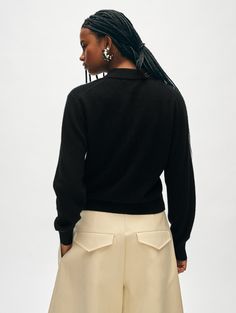 This polo combines soft cashmere, a relaxed fit, and a face-framing collar for a modern take on the wardrobe staple. Complete with ribbed trims, it looks especially effortless worn alone with a few buttons undone. Details Relaxed fit. Long Sleeve. Length in size small is 23". The model is 5'10 1/2" and is wearing a size small. 100% Cashmere. Hand wash cold or dry clean. Do not twist or wring. Reshape and lay flat to dry. Warm iron if needed. Style #20889 Black Cashmere Polo Sweater For Work, Elegant Fall Sweater With Polo Collar, Elegant Collared Polo Sweater With Ribbed Cuffs, Black Polo Sweater With Collared Neckline For Workwear, Winter Workwear Polo Sweater With Collared Neckline, Elegant Polo Collar Sweater For Work, Collared Fine Knit Sweater For Work, Collared Cashmere Polo Sweater In Fine Knit, Fine Knit Cashmere Polo Sweater