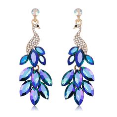 PRICES MAY VARY. Exquisite Peacock Design: These boho peacock sparkly rhinestone earrings feature a stunning peacock-inspired design that exudes elegance and sophistication. Crafted with intricate details and sparkling rhinestones, the peacock motif adds a touch of regal beauty to any ensemble, making them a standout accessory for special occasions or everyday wear. Versatile Statement Piece: With their bold geometric drop silhouette, these earrings serve as a versatile statement piece that effo Peacock Motif, Colorful Crystals, Peacock Earrings, Rectangle Earrings, The Peacock, Peacock Design, Shimmer N Shine, Fantasy Jewelry, Crystal Embellishment