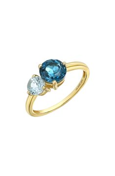 Two prong-set semiprecious stones bring vibrant sparkle to the center of this handcrafted 14-karat-gold ring and adds rich color to any stack. 1/2"W x 1/4"L setting Total stone weight: 1.43ct. 14k gold/blue topaz and peridot, blue topaz and citrine or blue topaz Imported Fine Jewelry Yellow Gold Round Cut Gemstones, Luxury Yellow Gold Topaz Birthstone Ring, Multi-stone Yellow Gold Birthstone Ring In 14k, Elegant Multi-stone Topaz Ring In 14k Gold, Multi-stone 14k Yellow Gold Birthstone Ring, Yellow Gold Multi-stone Birthstone Ring In 14k Gold, 14k Yellow Gold Multi-stone Birthstone Ring, Yellow Gold Blue Topaz Rings With Brilliant Cut, Yellow Gold Rings With Brilliant Cut Blue Topaz