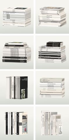 several stacks of books sitting on top of each other in front of a white background