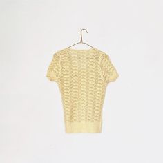 Vintage 70s cotton crochet sweater shirt - loosely knit delicate shell/fan pattern. Light pastel yellow color is perfect for spring and summer! Simple cottage core style with petite fit - fits snuggly at knit hems [armhole, waist]. Lovely piece for layering in any season!Brand: unknownTag size: fits like an XS, exact measurements belowMEASUREMENTSshoulder: 3 inchessleeve length: 9 inchessleeve hem: 8- 13 inches [13 inches fully stretched]center front to hem [beginning at V neck]: 15 inchescenter Cottage Core Style, Crochet Short, Pastel Yellow, Pullover Sweater Women, Short Sleeved Sweaters, Cotton Crochet, Cotton Lights, Fashion Flats, Crochet Sweater