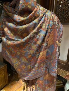 This is one of our favorites and certainly the most popular in a deep jewel tone on black, 28 X 70 inch This vintage-styled shawl features our paisley brocade design, styled from ancient Jamawar Kashmiri motifs Very soft and durable silk blend Free shipping in the US Our shawls arrive wrapped in tissue paper in a stylish peacock mailer. Gift wrap is available. Thank you Etsy community for your support! We are grateful for thousands of great reviews! Traditional Paisley Print Shawl For Fall, Multicolor Paisley Print Pashmina Shawl, Multicolor Paisley Print Pashmina, Festive Multicolor Paisley Print Pashmina Shawl, Festive Multicolor Paisley Pashmina Shawl, Vintage Multicolor Festive Shawl, Festive Vintage Multicolor Shawl, Elegant Multicolor Paisley Print Dupatta, Brown Pashmina Shawl With Paisley Print