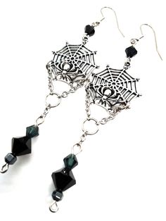 Made to Order! This earring set features a spider on its web. Perhaps it is reeling in its tangled prey? They can be worn with Gothic, fantasy inspired, steampunk or any other outfits you wish. This elegant design is the perfect pair with one of my necklaces or rosary chains! They also go really well with layers of stacked silver statement necklaces. These earrings make a perfect gift for someone who loves spiders and insects or ornate silver toned jewelry. Each earring weighs approx. .2 oz. ﻿Th Black Earrings For Halloween Cosplay, Black Halloween Cosplay Earrings, Fantasy Dangle Earrings For Halloween, Halloween Fantasy Dangle Earrings, Fantasy Halloween Dangle Earrings, Gothic Metal Earrings For Halloween, Gothic Earrings For Halloween, Halloween Fantasy Earrings For Pierced Ears, Gothic Earrings For Costume Party