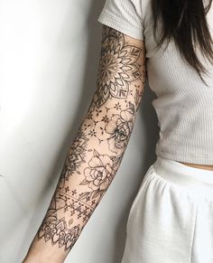 a woman with a tattoo on her arm