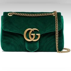 Gucci Velvet Marmont Matelasse Flap Chain Emerald Green Bag Ships Same Day Or Within 24 Hours Of Payment Rare Dark Emerald Green Color. Brand New With Dust Bag And Authenticity Tags As Shown. Gorgeous Dark/ Emerald Green Velvet With Gold Toned Hardware. Interior Is Satin Lined In Pink. This Is A Gorgeous Bag For Any Season! Measurements: Approx 12"W X 7.5"H X 3"D Drop 11.25in Drop 20.25in Chain Strap With Leather Pad Is Adjustable For Shoulder Or Crossbody Wear. Please Look At Pictures For Measu Green Purses, Green Gucci, Velvet Handbag, Green Shoulder Bag, Velvet Purse, Gucci Purse, Gucci Brand, Green Handbag, Green Purse