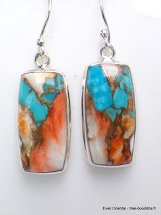 Turquoise Spiny Oyster rectangular earrings in 925 silver Spiny Oyster Turquoises are a composite of Arizona turquoise and spiny oyster. The two minerals are welded together by white metal or copper. Total height of earrings 4.1 cm Width of earrings 1.2 cm Real turquoise and oyster Hallmarked Silver 925 Comes with certificate of authenticity Sterling Silver Rectangular Gemstone Earrings, Nickel Free Turquoise Rectangular Jewelry, Artisan Turquoise Rectangular Jewelry, Rectangular Sterling Silver Jewelry With Inlay, Handmade Southwestern Rectangular Jewelry, Southwestern Handmade Rectangular Jewelry, Unique Rectangular Inlay Jewelry, Nickel-free Multicolor Rectangular Earrings, Rectangular Inlay Jewelry For Gifts