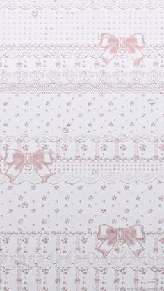 a white and pink wallpaper with bows on it