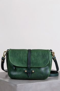 Santa Fe Bison Leather Two-Tone Crossbody Clutch | Overland Travel Crossbody Saddle Bag With Smooth Grain, Green Leather Flap Bag For Everyday Use, Everyday Green Leather Flap Bag, Saddle Flap Bag With Detachable Strap For Everyday Use, Green Leather Flap Bag, Everyday Saddle Flap Bag With Detachable Strap, Textured Leather Satchel Flap Bag For Everyday Use, Everyday Saddle Bag With Smooth Grain, Everyday Use Saddle Flap Bag With Detachable Strap