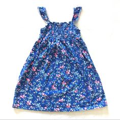 Carter’s Blue Dress With Floral Print. 100% Cotton. Smocked Yoke, Flutter Sleeves, All Over Floral Print. Washed But Never Worn. Blue Floral Print Cotton Smocked Dress, Blue Casual Cotton Smocked Dress, Casual Blue Cotton Smocked Dress, Playful Smocked Dress For Spring Playdate, Blue Cotton Smocked Sundress, Summer Smocked Dress With Ruffles For Playdate, Spring Dress With Smocked Bodice For Playdate, Casual Cotton Smocked Dress With Flutter Sleeves, Floral Print Smocked Dress For Playtime In Summer