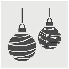 two christmas balls hanging from strings