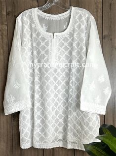 Soft cotton Chikankari hand embroidered blouse. Liner included  Length: 30 inches Luxury Fitted Blouse With Chikankari Embroidery, Luxury White Blouse Piece With Chikankari Embroidery, Luxury Chikankari Embroidery Blouse Piece In Katan Silk, White Blouse With Zari Work For Eid, White Zari Work Blouse For Eid, Embroidered Straight Kurta Top In Chanderi, Embroidered Chanderi Straight Kurta Top, White Cutdana Blouse For Eid, White Anarkali Blouse For Eid