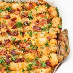 a casserole dish with bacon and green onions