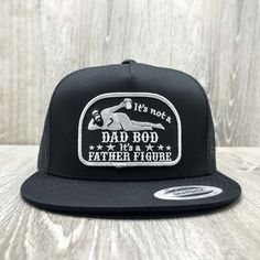 This Dad Bod "It's a Father Figure" funny embroidered patch on an all black Yupoong 6006 Classic high-crown mesh snapback baseball cap. Our patches are super high-quality and embroidered here in the USA. Each hat is made to order. We know you will love it! Black Embroidered Trucker Hat, Fitted Black Trucker Hat, Black Fitted Trucker Hat, Black Embroidered Snapback Trucker Hat, Adjustable Black Trucker Hat For Father's Day, Black Flat Bill Hats For Father's Day, Embroidered Black Trucker Hat, Black Embroidered Trucker Cap, Adjustable Embroidered Black Trucker Hat