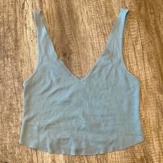 Stretchy, Can Fit Small Or Medium, Never Worn Casual Seamless Crop Top For Vacation, Chic Blue Tank Top For Everyday, Chic Blue Everyday Tank Top, Light Blue Seamless Tank Top, Light Blue Casual Crop Tank Top, Casual Light Blue Crop Tank Top, Light Blue V-neck Casual Crop Top, Casual Light Blue V-neck Crop Top, Blue Seamless Tops For Vacation