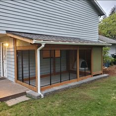 a house with a screened porch and covered patio